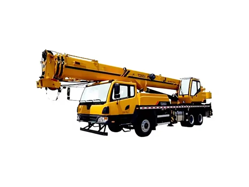 Maintenance technician inspecting XCMG 25 ton crane with manual