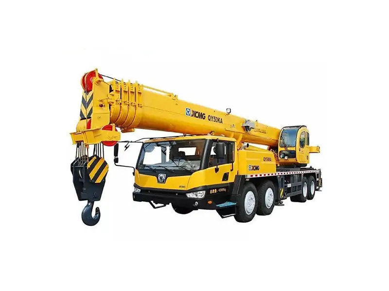 Maintenance technician inspecting XCMG 50 ton crane using official manual
